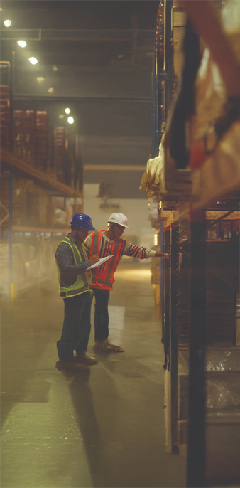 Warehouse staff inspecting inventory at a Pittie Group facility