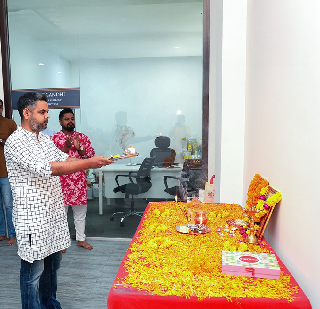 Employee performing a traditional puja ceremony at the Pittie Group office
