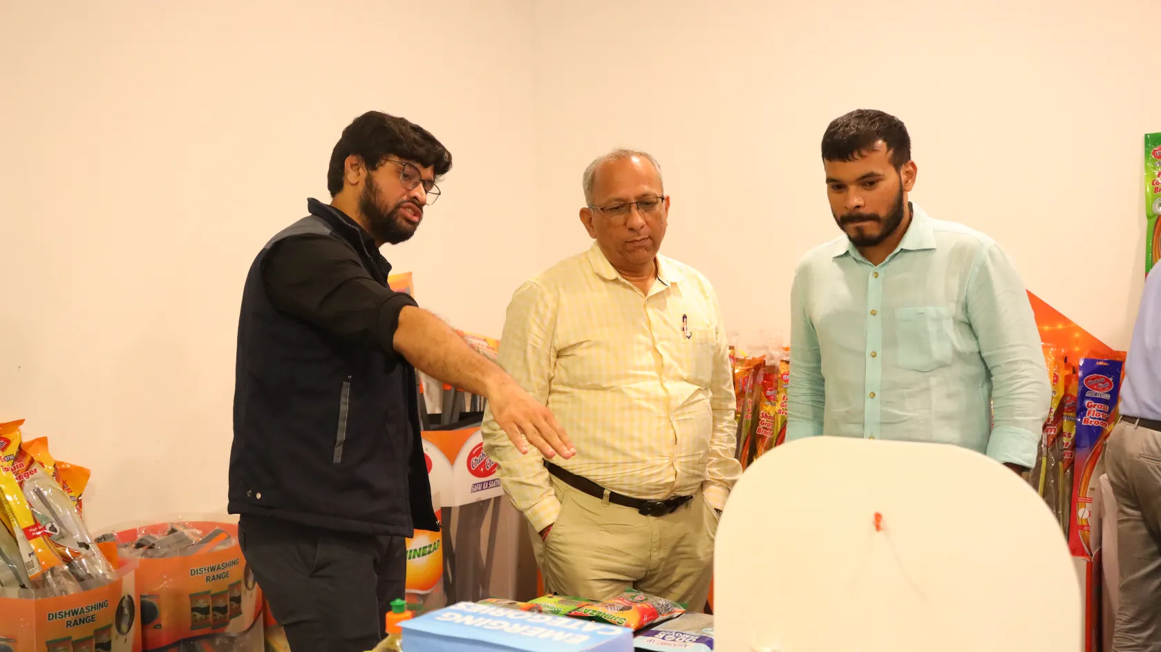 Employees reviewing Chaakachak product display at Pittie Group