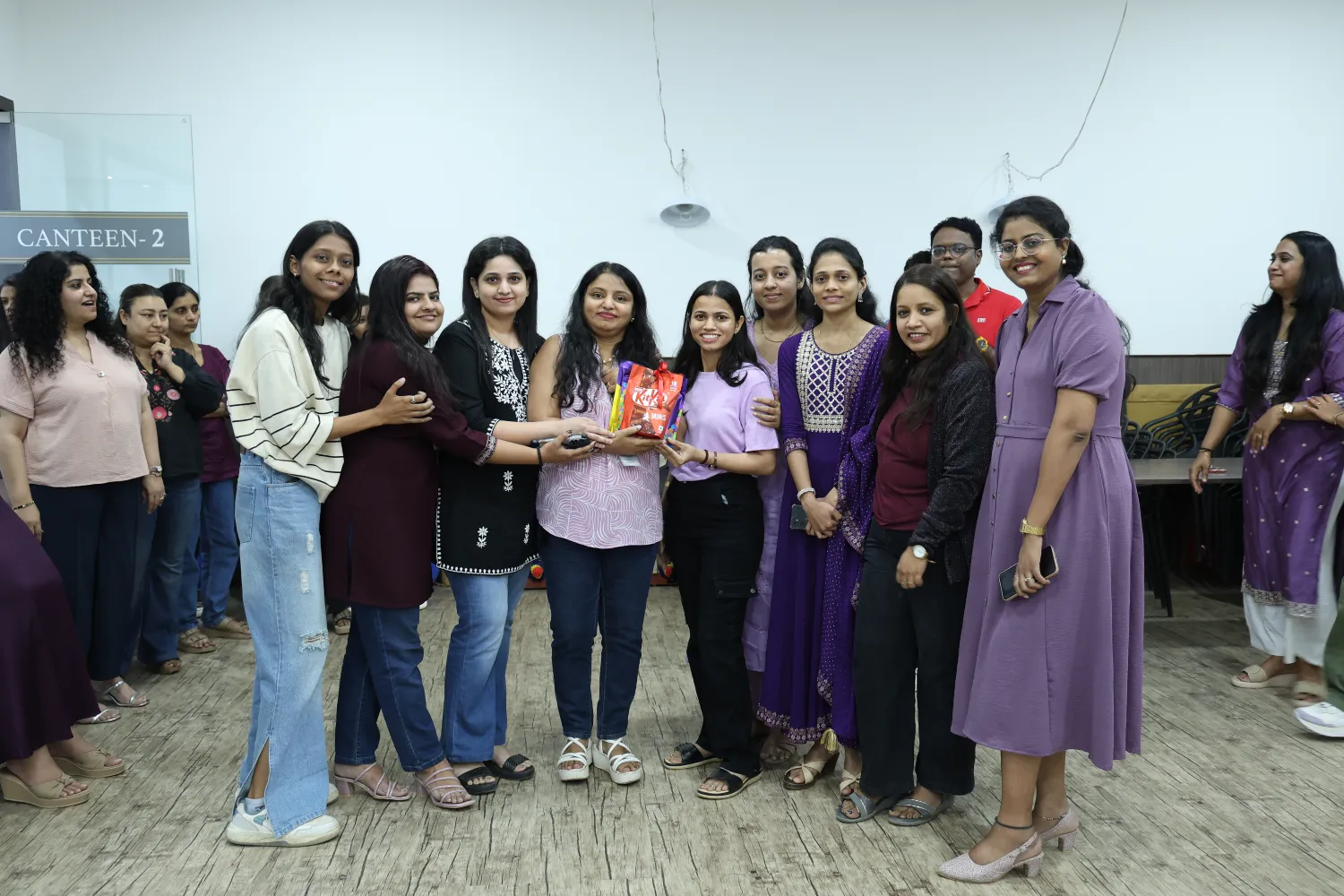 Employees celebrating together in the office canteen at Pittie Group