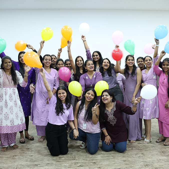 Women employees celebrating with balloons at Pittie Group